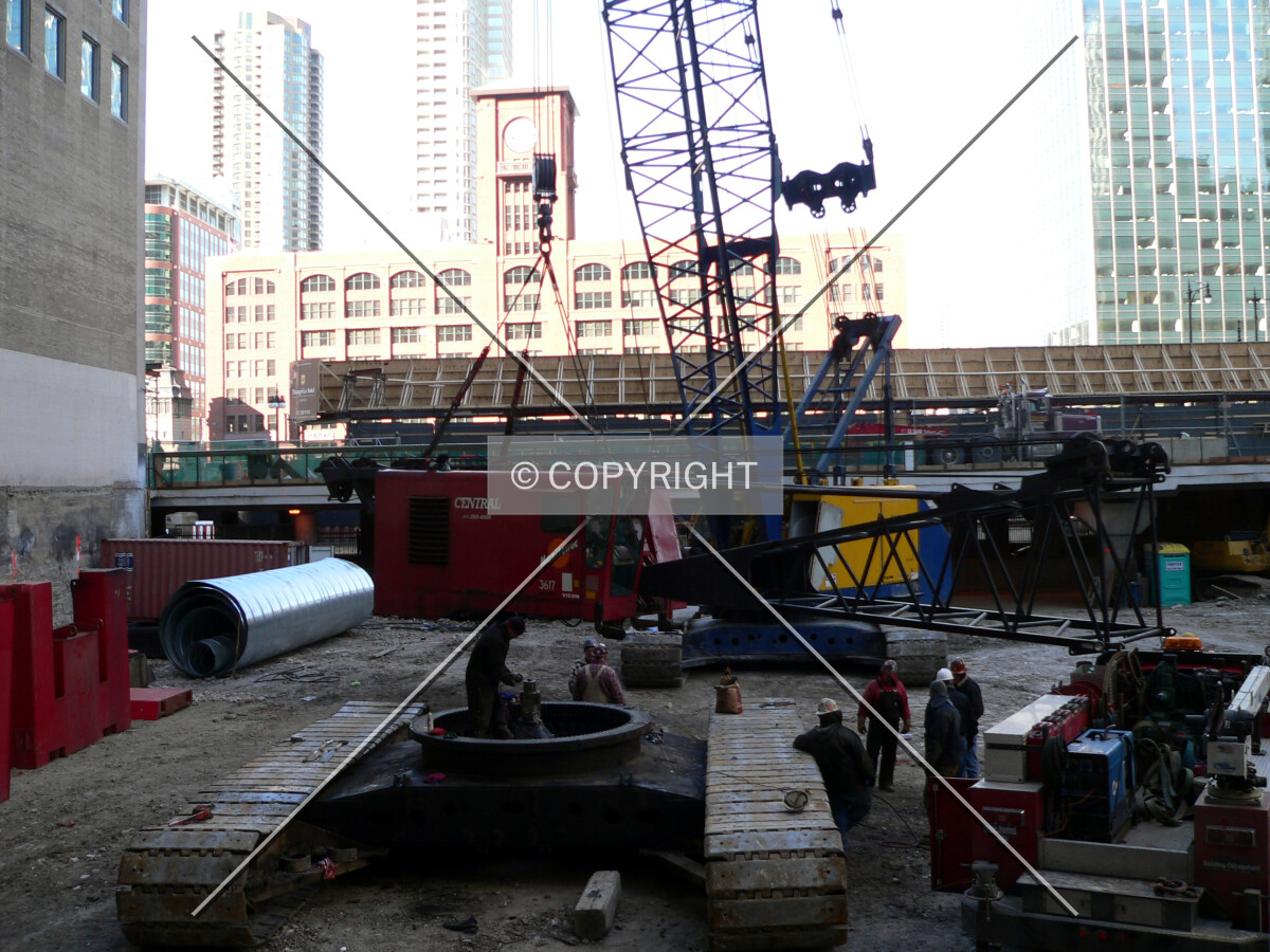 View to the north across the site as a service crane is assembled