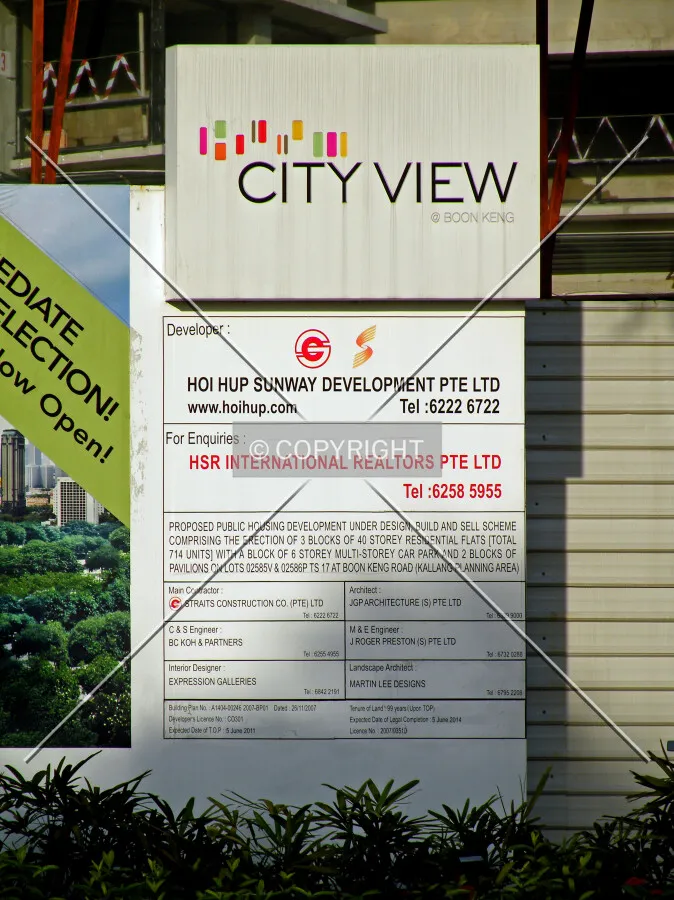 Project information displayed on the construction site fence