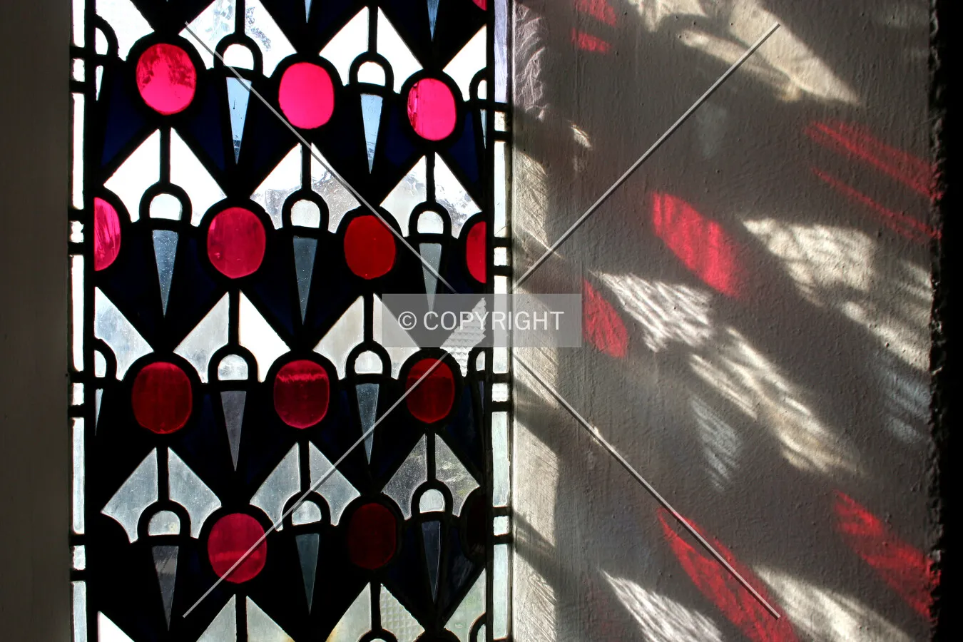 Stained glass and its shadow