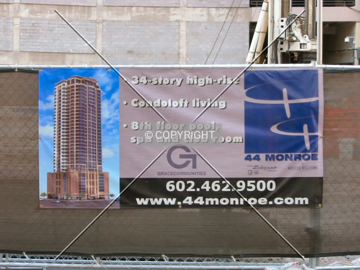 Project banner on Monroe Street barricade