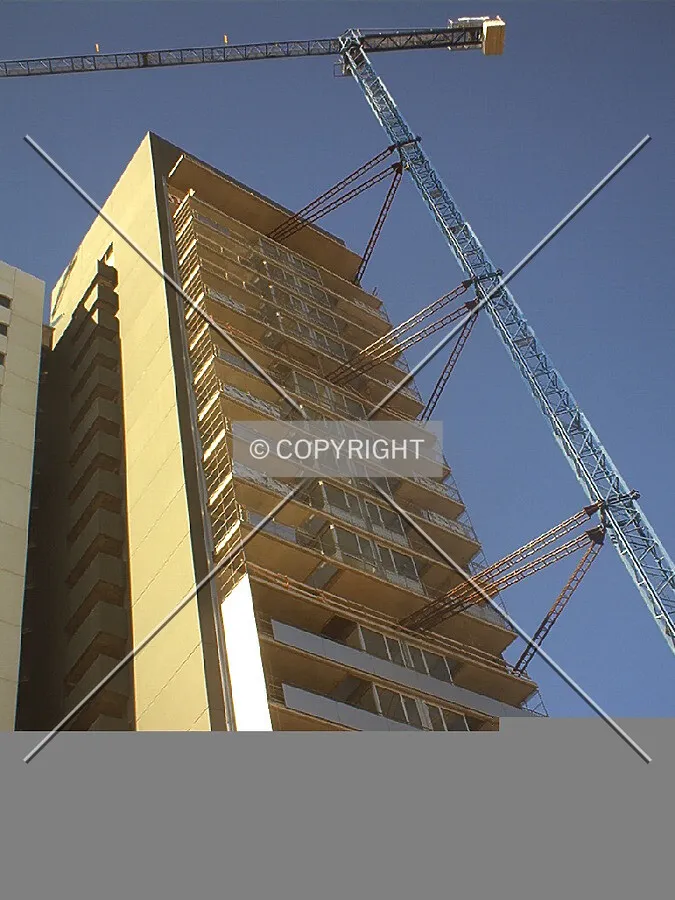 Looking up the building and crane