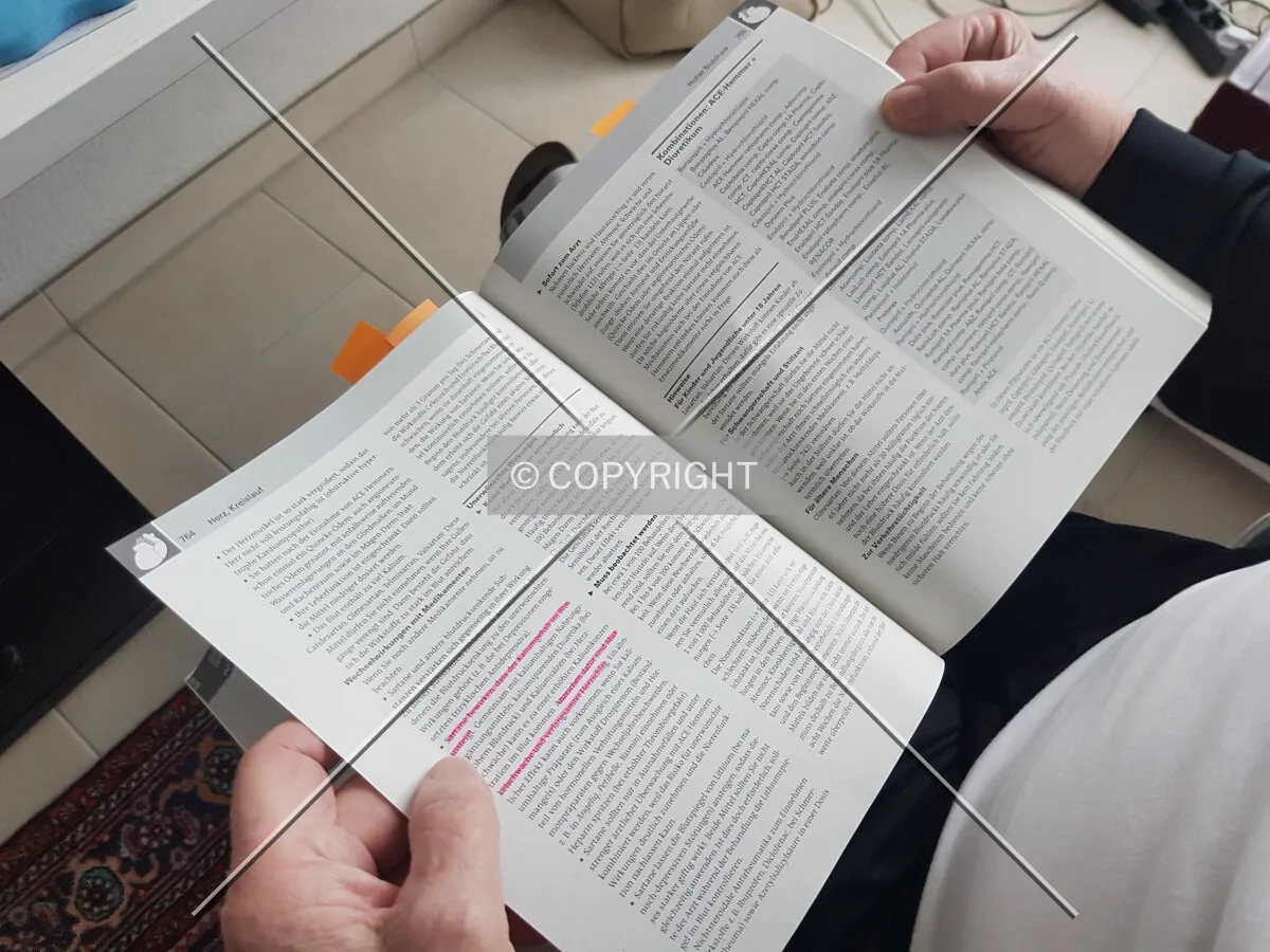 A man is readying a book