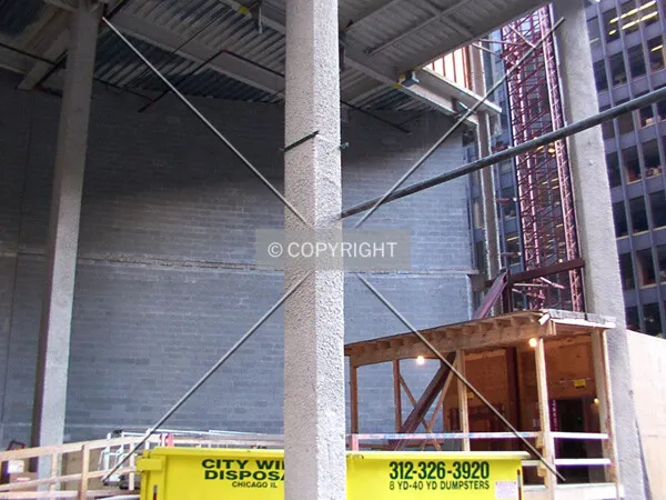 View of the west lobby, showing curved wall of cinder blocks