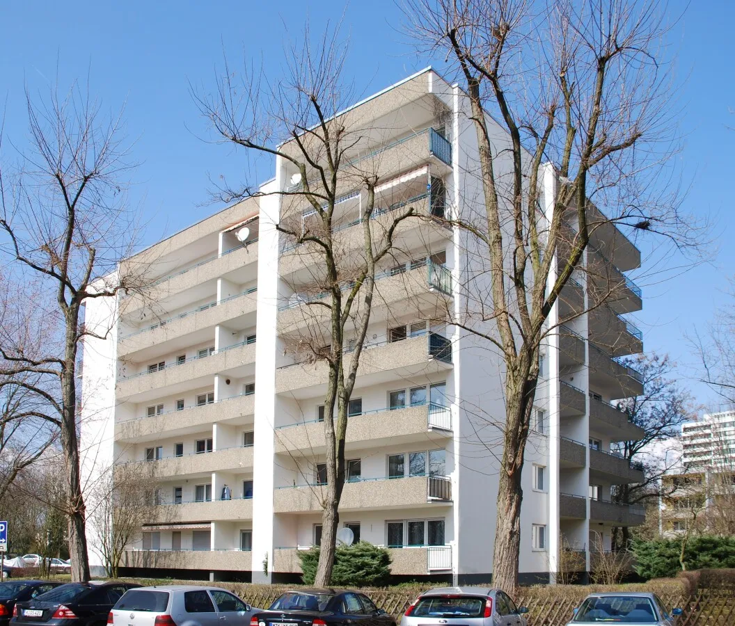 Apartment block behind trees