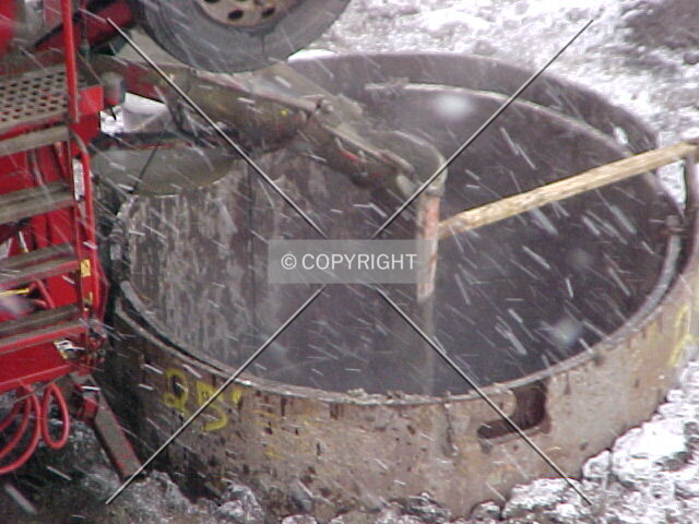 Pouring concrete to create a caisson