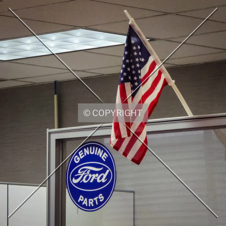 Ford sign and flag on the side of a cube wall; February 11, 2025
