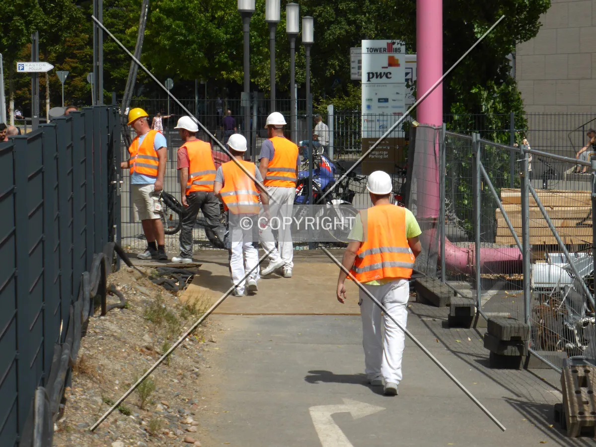 Construction workers walking on the street in Frankfurt, Germany