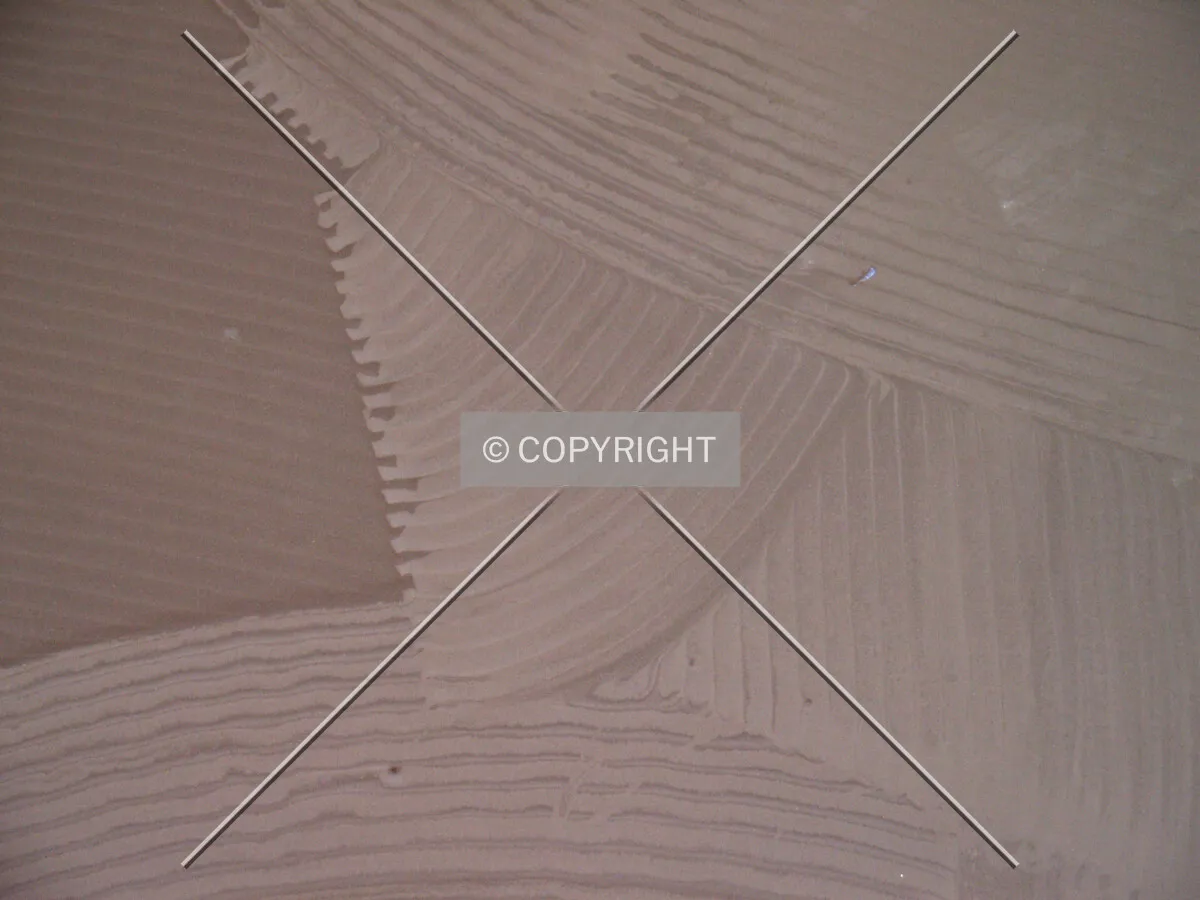 Close-up of the cement in the vestibule floor before tile installation