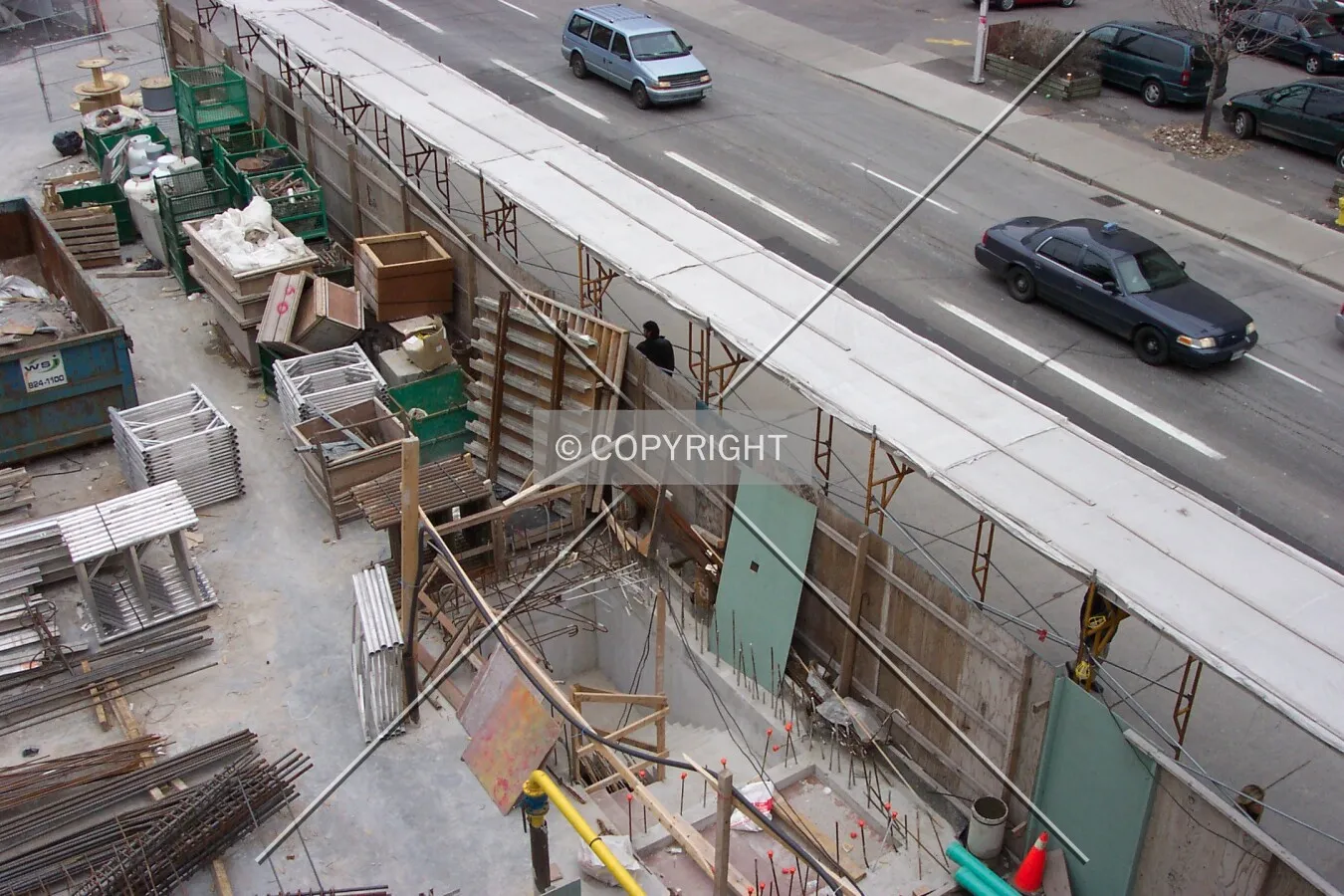 Protective scaffolding covering the pedestrian sidewalk