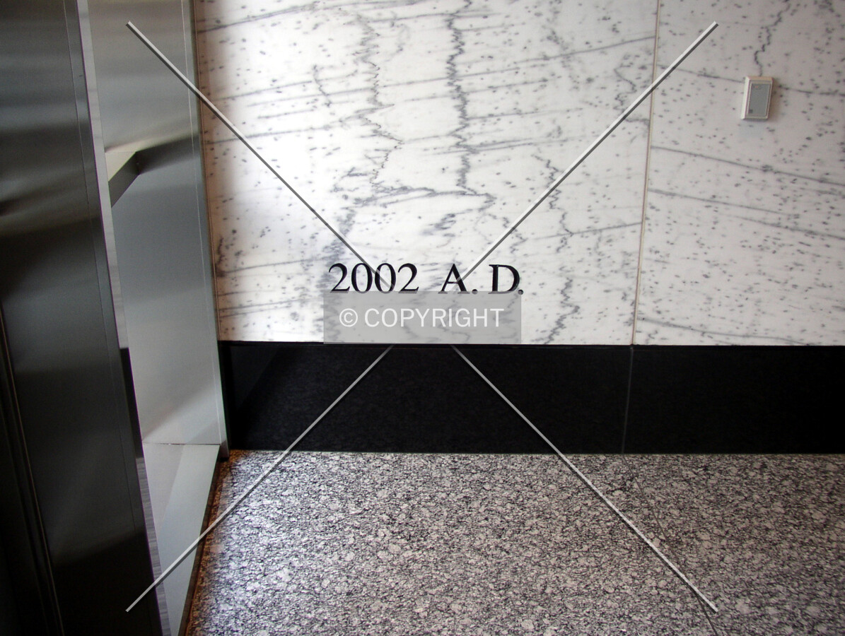 Dedication stone inside the main entranceway off North Tryon Street