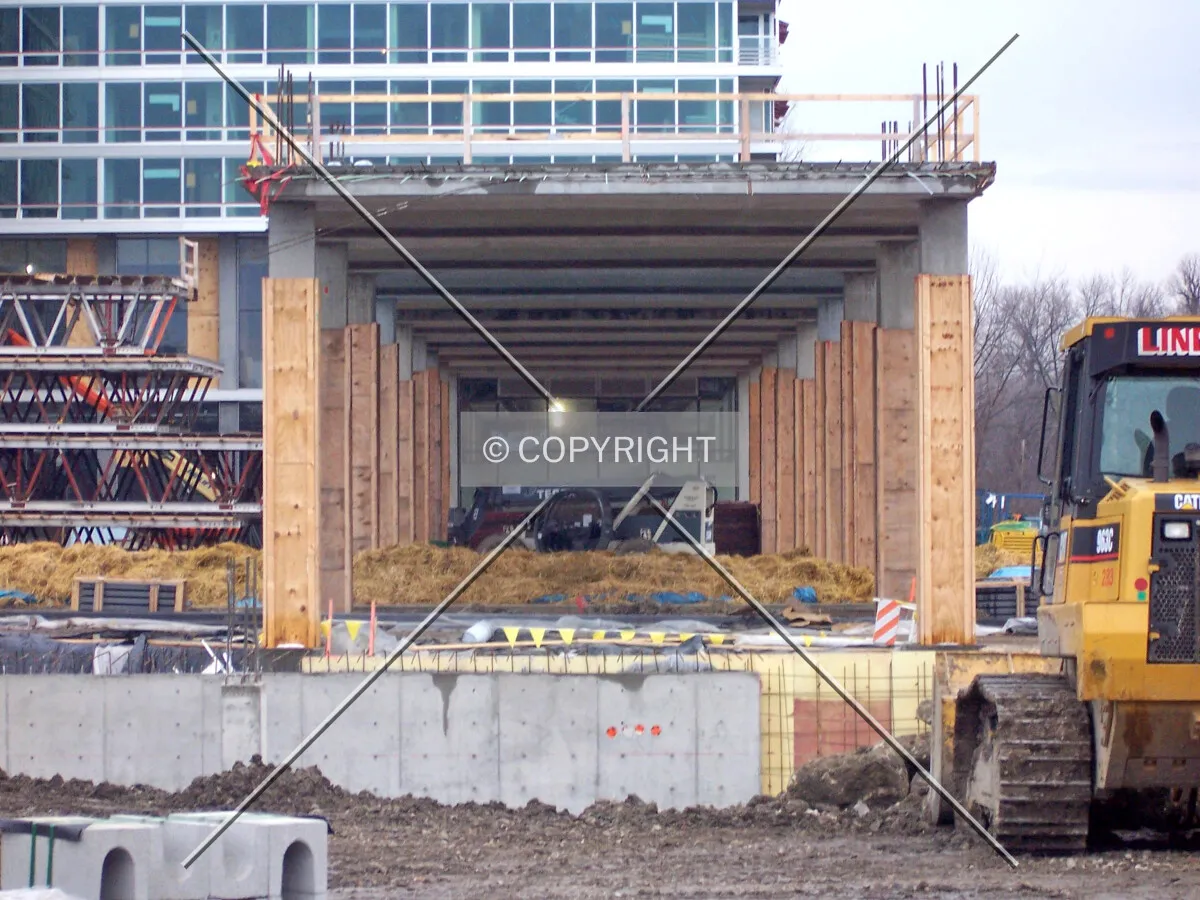 Looking south through the colonnade that will link the Oak and Maple Towers; the foundation walls of the Maple Tower are seen in the foreground