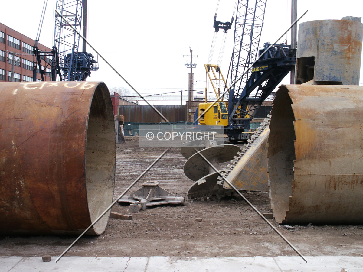 Two caisson linings, one with a jagged edge