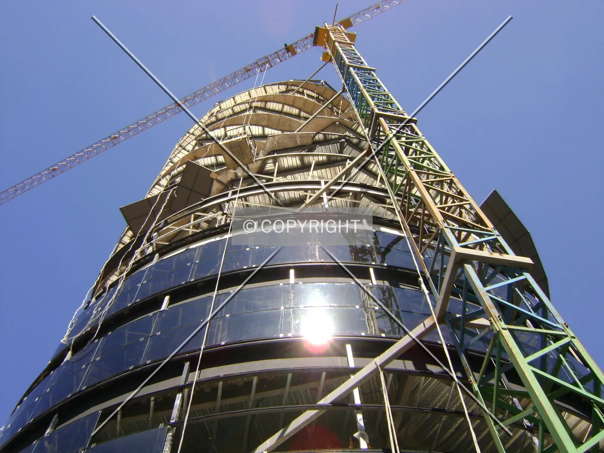 Looking up the structure and the crane as crystal skin is placed