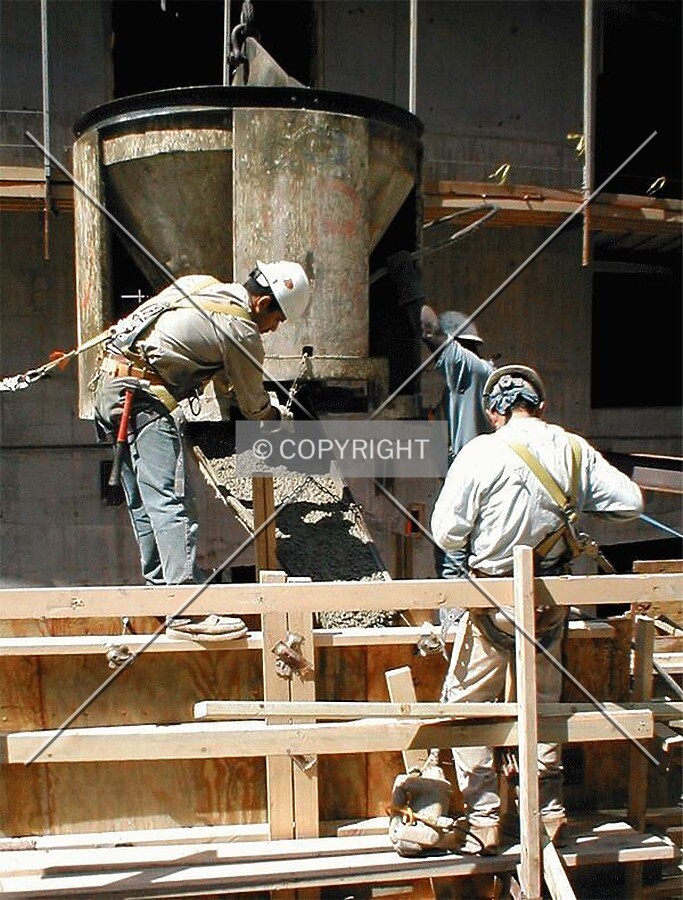 Ozinga ready mix concrete poured into mold along Monroe Street