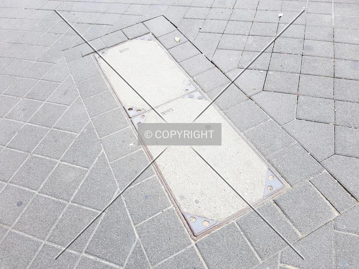 Channel under a street containing communication cables