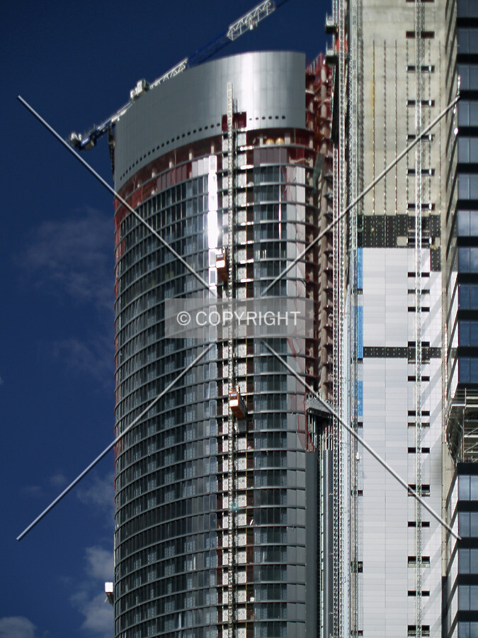 Top floors as seen from the south, with the Repsol tower in front