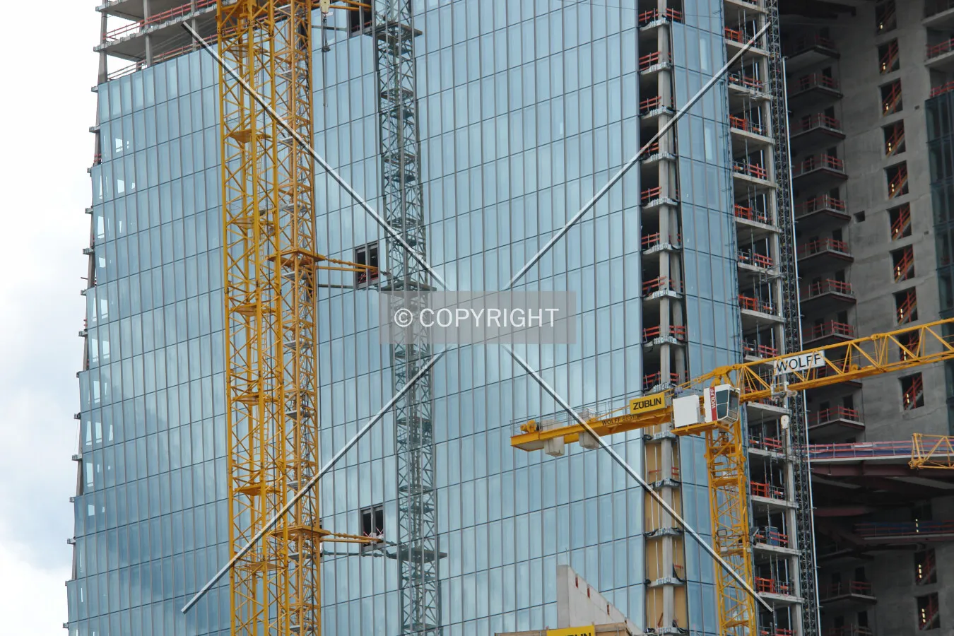 Cranes in front of the partly finished shell