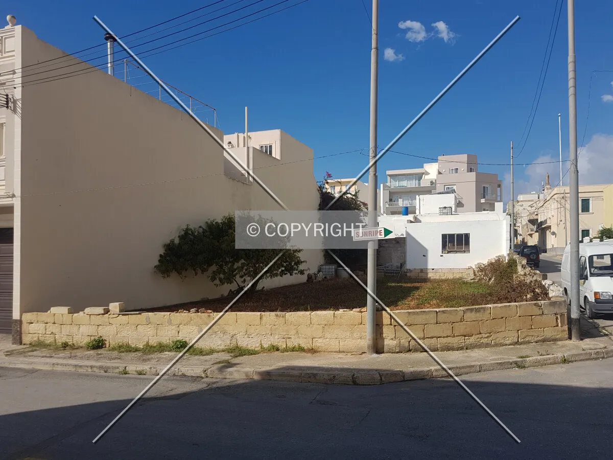 A land parcel not occupied with any structure