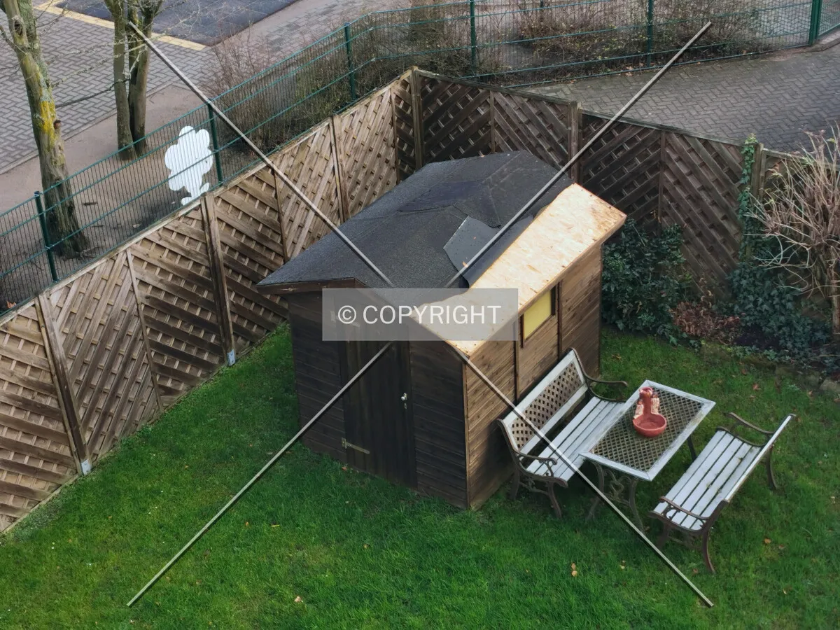 A small hut in a backyard