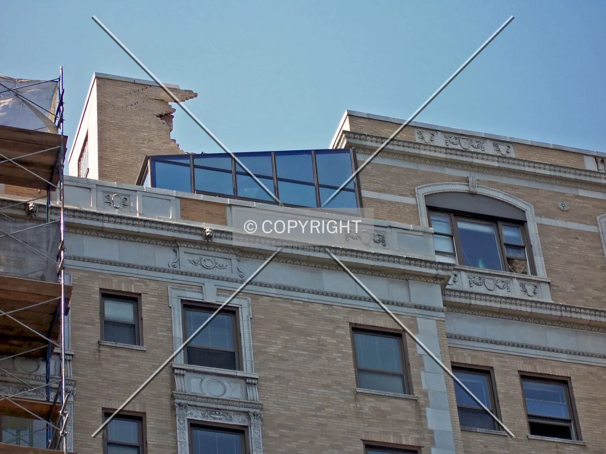 Upper floors and penthouse level on the east side of the mid-rise building. Part of the mechanical penthouse has already been demolished
