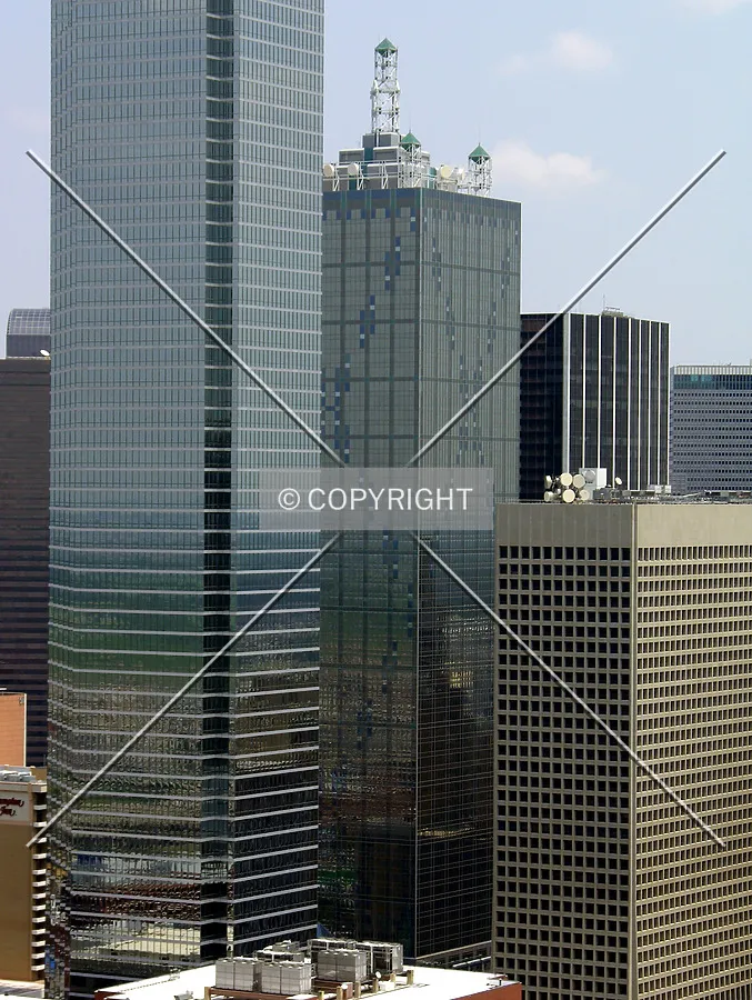 Peeking from behind the Bank of America Plaza is Dallas' second tallest