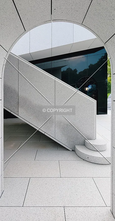 Looking through an arch towards the interior staircase; August 1, 2021