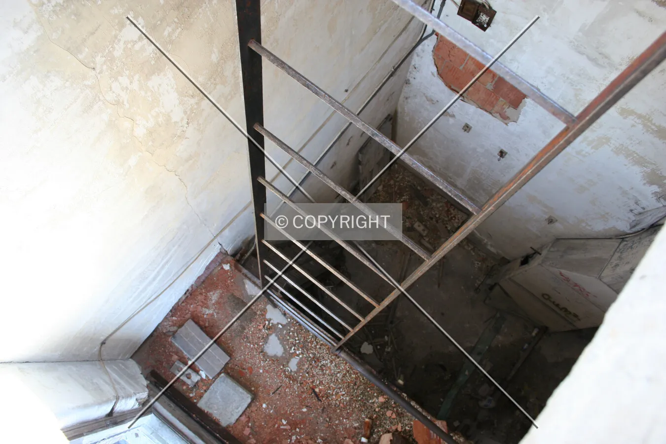 Looking down the ladder from the upper terrace