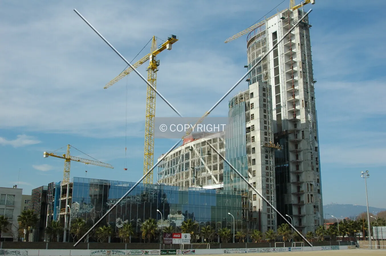 High-rise and building podium from a nearby soccer field