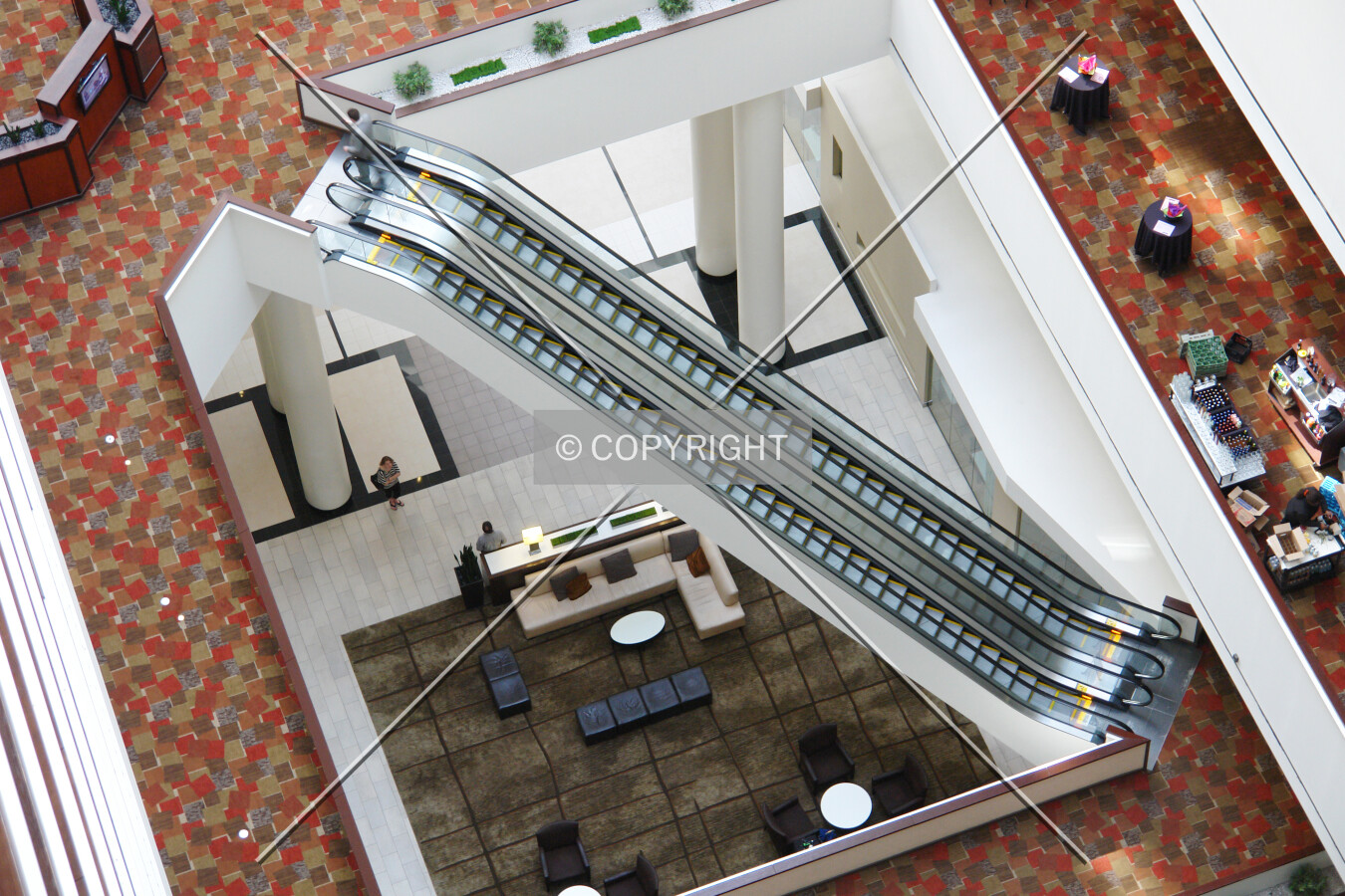 Two escalators in a hotel lobby
