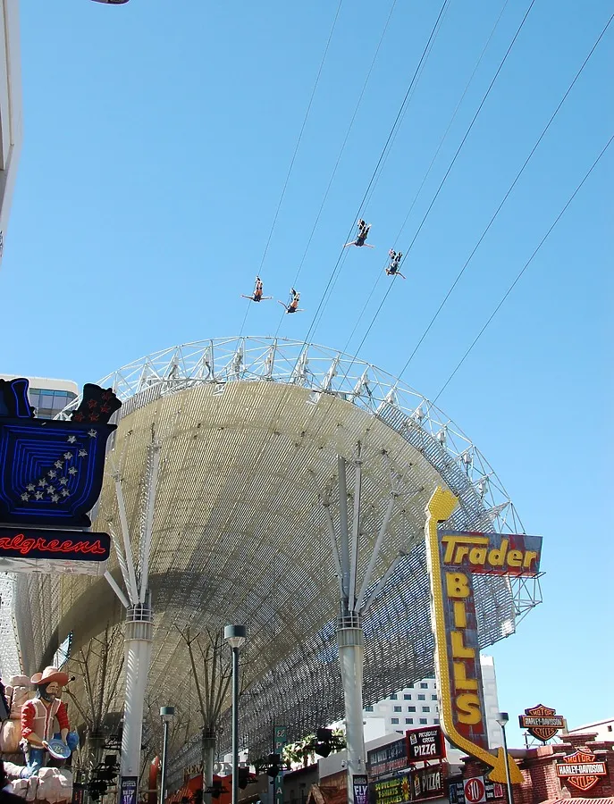 Zipline riders going under the Fremont Street Experience canopy
