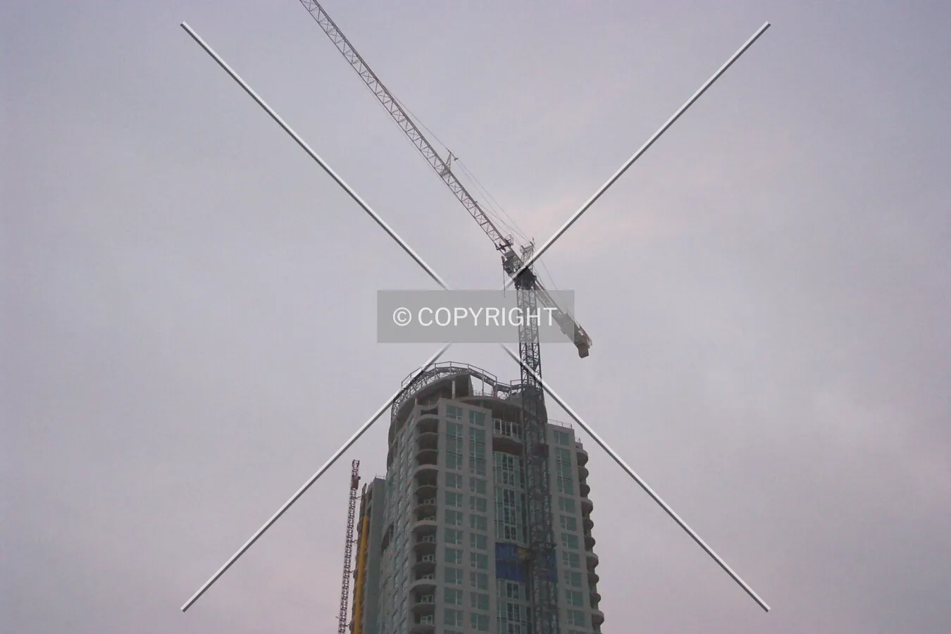 Looking up at the crown of the tower, and the crane