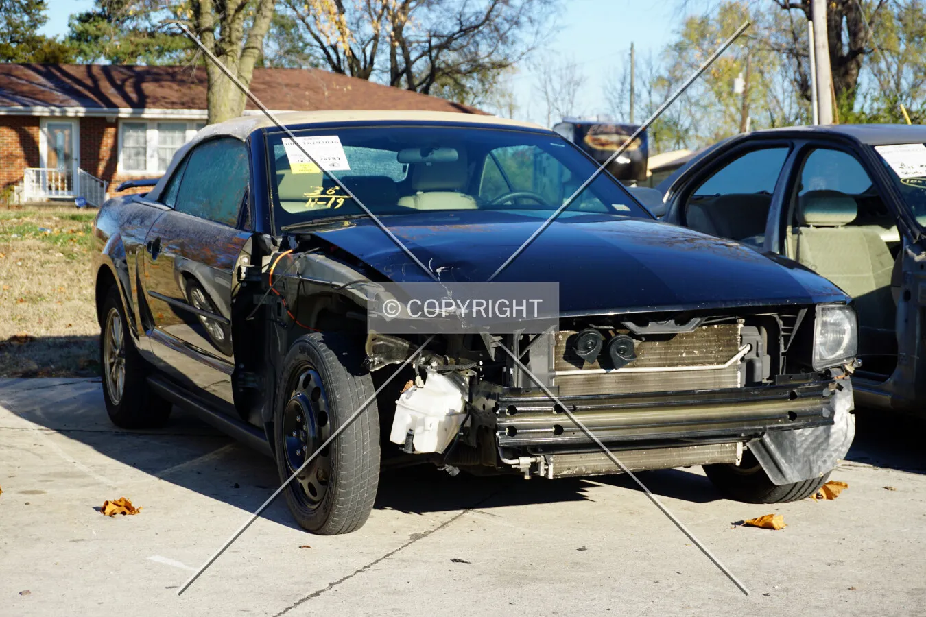 A damaged Ford Mustang convertible; November 22, 2015