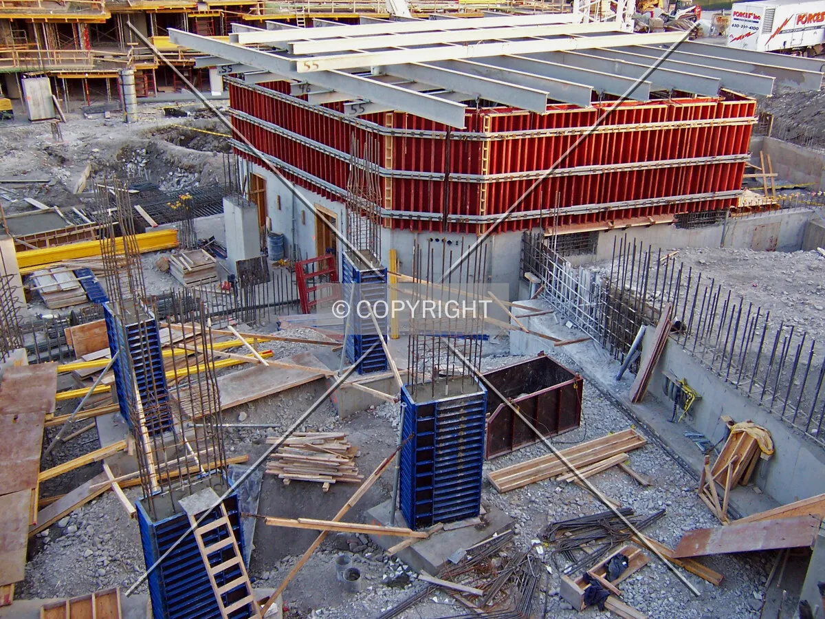Coulmns rising from the northeast corner of the tower fooprint, and the base of the elevator core