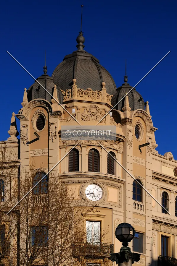 View of Rambla and Plaça Catalunya building's corner with three black domes on top