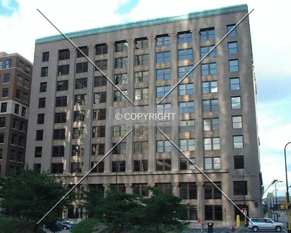 4th Avenue facade from Courthouse Plaze, bathed in reflected sunlight from the US Courthouse
