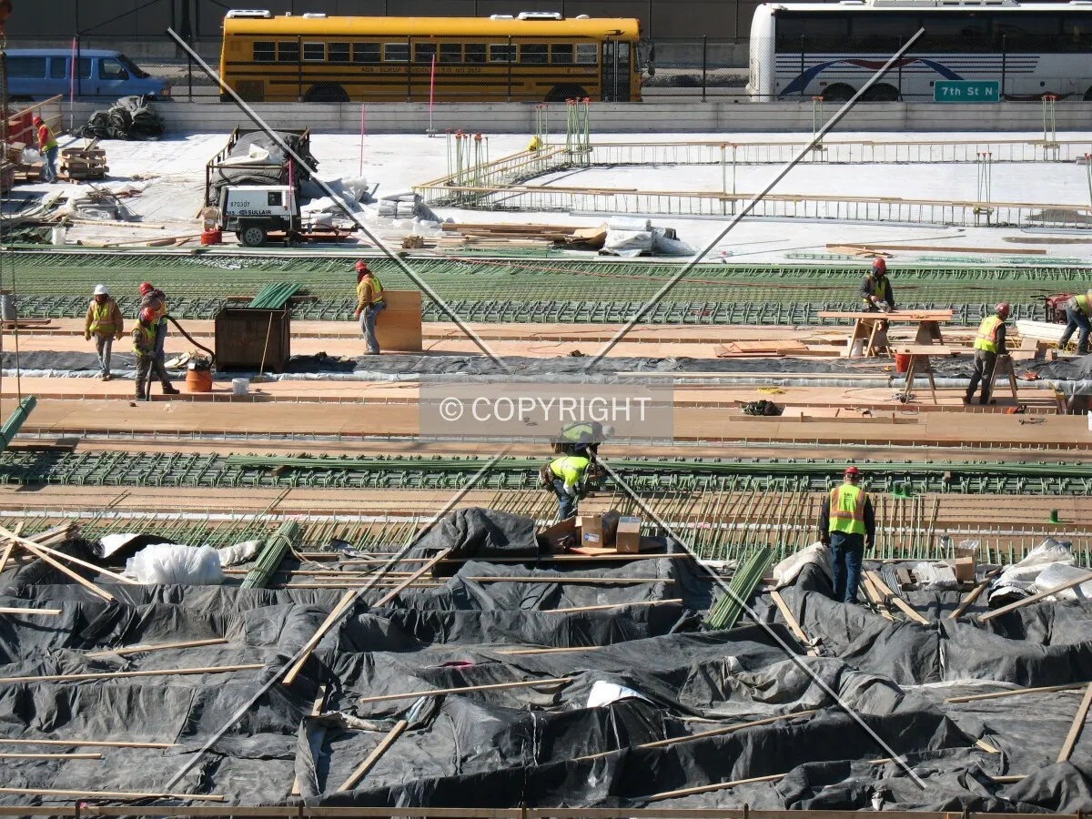 Construction workers on the future plaza