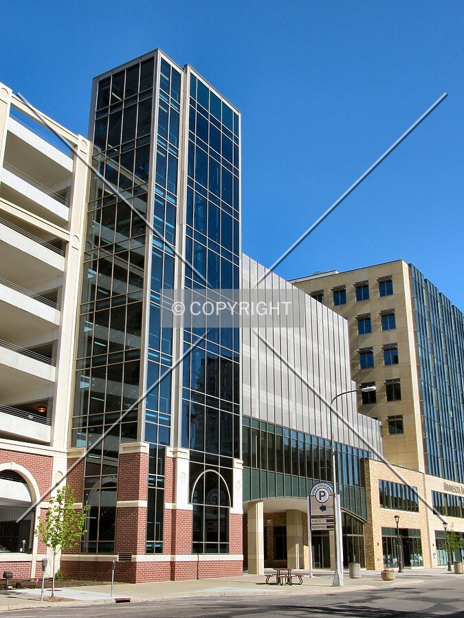 Vertical transportation tower and new addition bridging 3rd Street SW