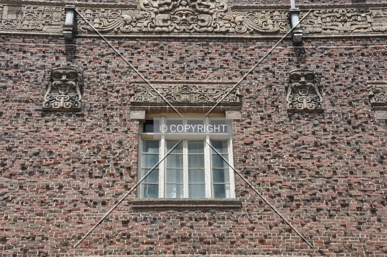 Detail of terra cotta lintel and masks