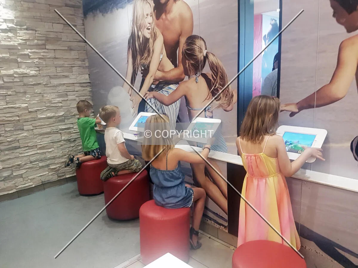 Children playing with tablets