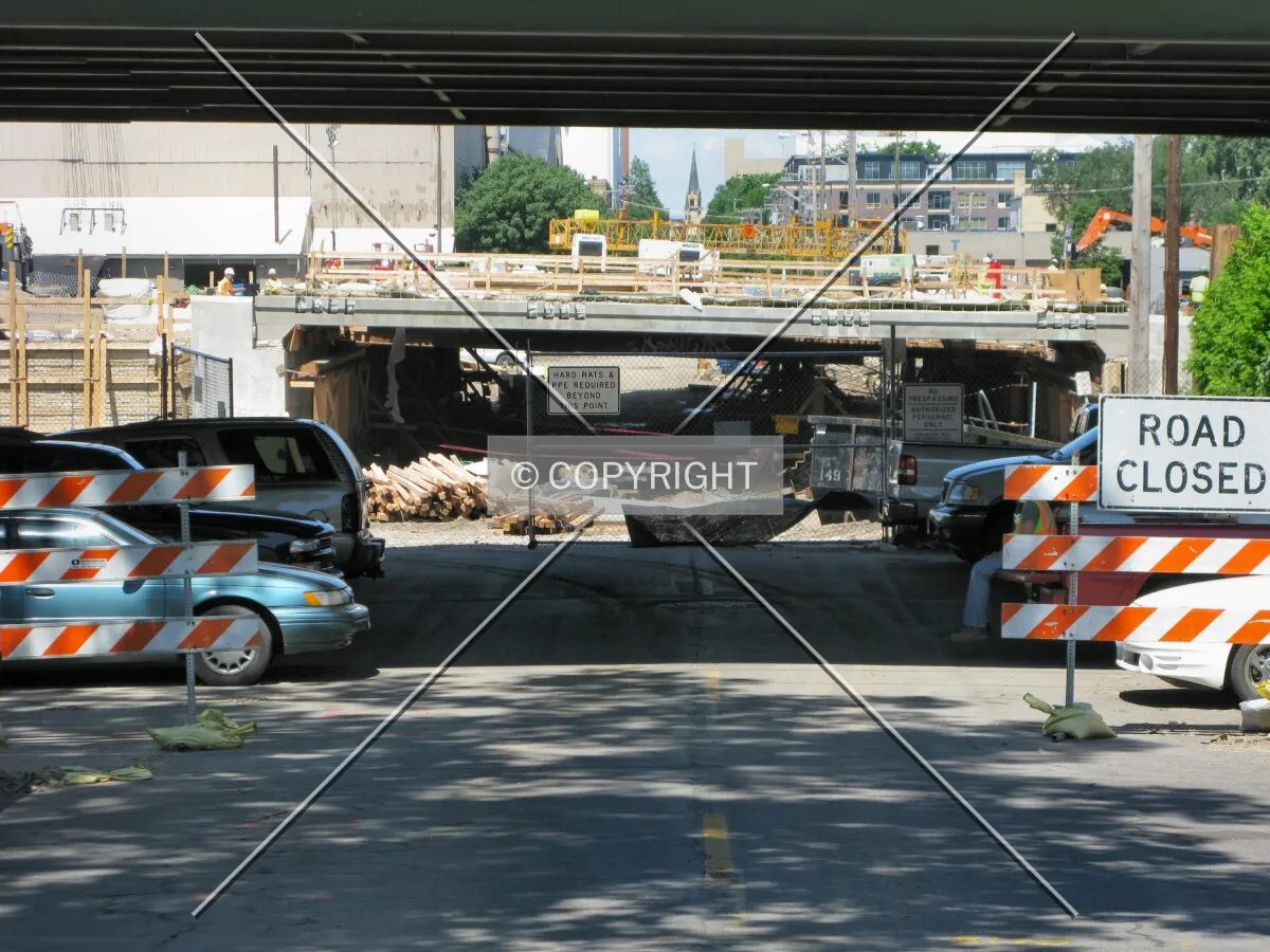View to the west along 2nd Street SE, under the 10th Avenue Bridge