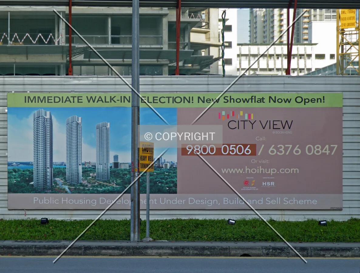 Project information displayed on the construction site fence