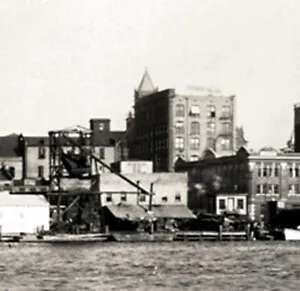 View from the northwest across the Cape Fear River with the Brownstone Post Office tower behind