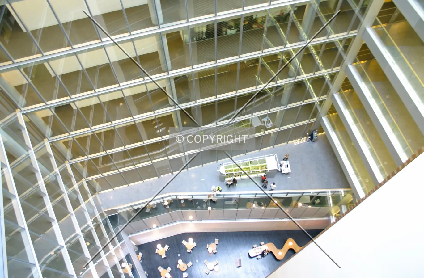 Looking down to the ground floor and third floor breakout area from an 11th floor balcony