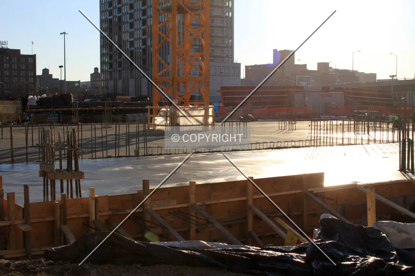 Wet concrete floor plate at ground level, viewed from the northeast