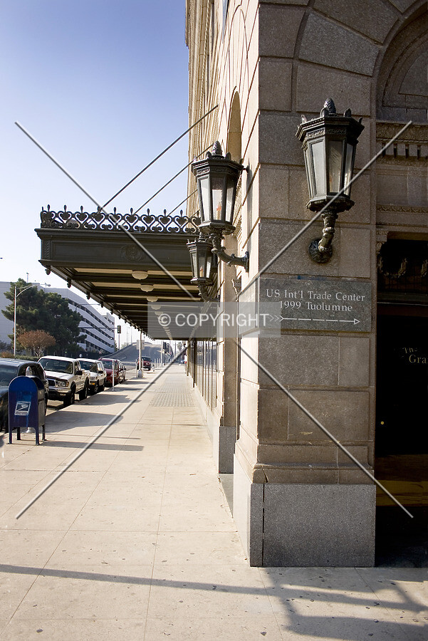 Lamps, awning and sign on southeast corner