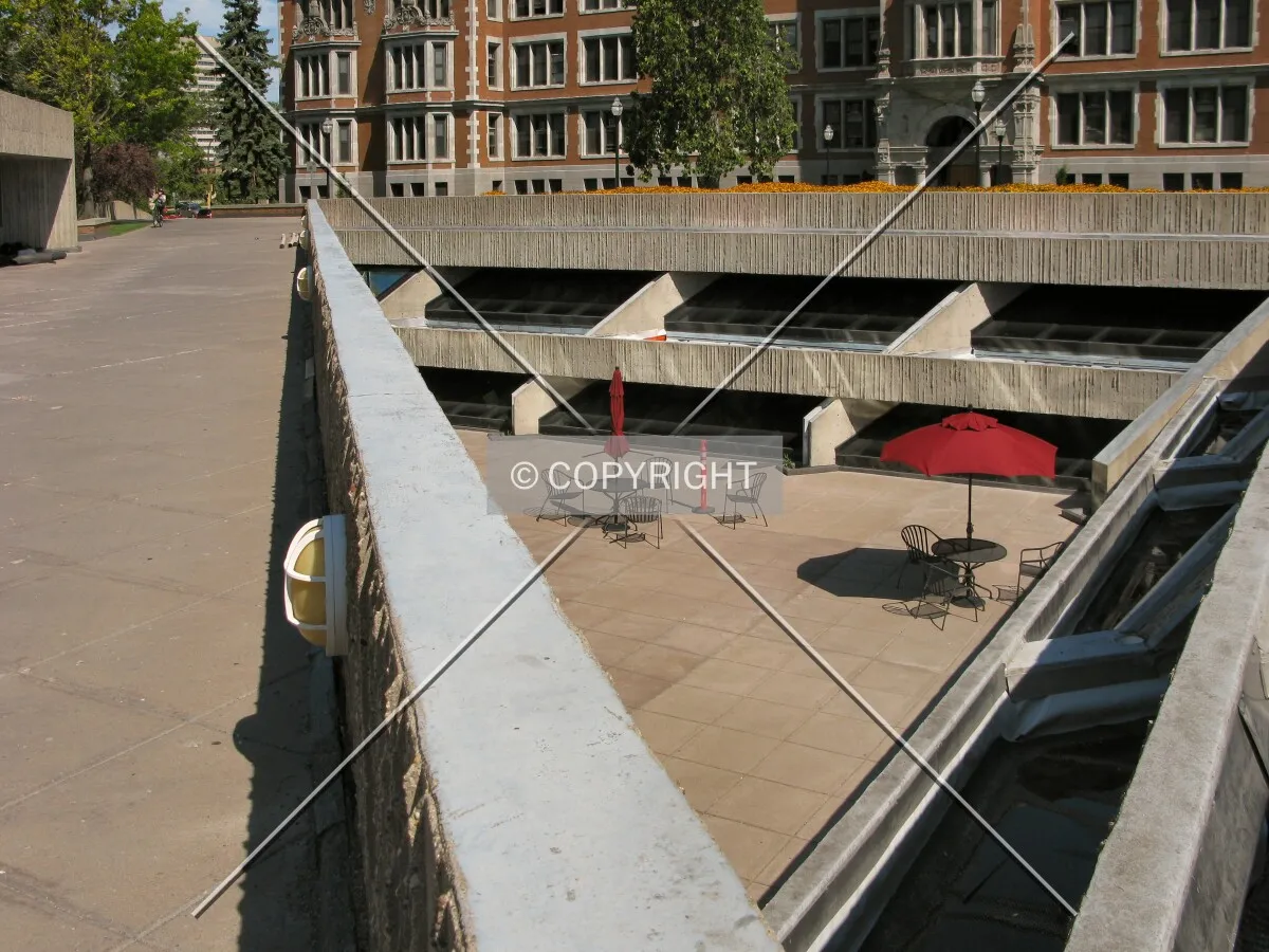 View to the northwest into the lower plaza, windows opening to underground levels