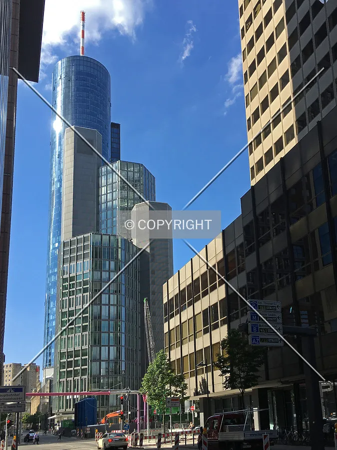 The construction site of Omniturm between Garden Towers (stacked building in the background and the brown building on the right side)