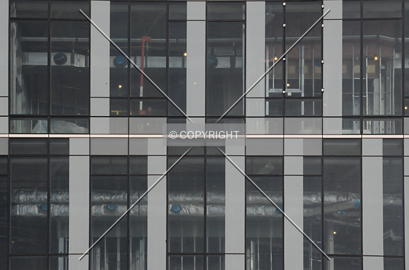 Glass facade and interior work on the southwest corner of the base