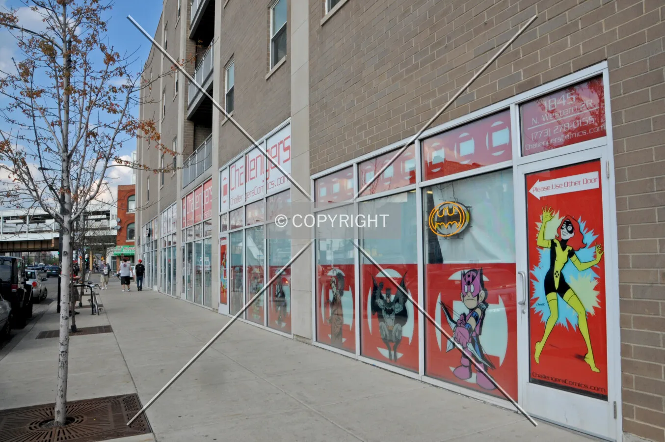 Storefronts along Western Avenue, viewed from the mid-block alley to the south. March 21, 2012.
