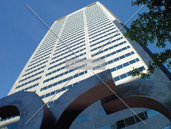 Rising above a plaza sculpture
